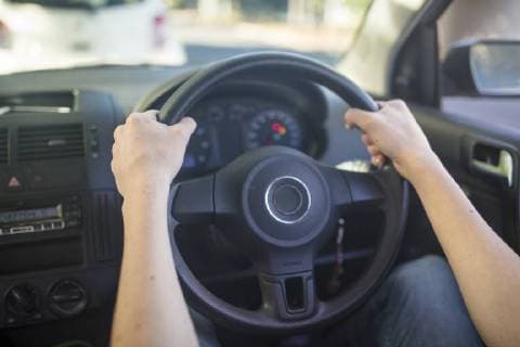 Male hands in car holding steering wheel model released Symbolfoto property released ZEF15786