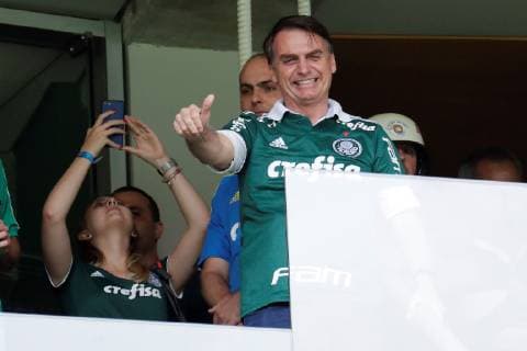 The elected president of Brazil, Jair Bolsonaro, wearing the Palmeiras Club shirt, greets supporters before the start of the match between Palmeiras and Vitoria for the Brazilian soccer championship, at the Allianz Parque stadium in Sao Paulo, Brazil, 02 December 2018. Palmeiras was proclaimed last Sunday, November 25, the Brazilian league champion for the tenth time and got it one date before the end of the tournament after beating Vasco da Gama at home by 1-0. Bolsonaro will assume the Brazilian Presidency next 01 January. Bolsonaro attends the match of the proclaimed champion of the Brazilian League, Palmeiras, against Vitória in Sao Paulo !ACHTUNG: NUR REDAKTIONELLE NUTZUNG! Copyright: xSebastiaoxMoreirax AME4420 20181202-636793808615753798