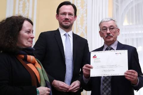 MOSCOW, RUSSIA – DECEMBER 11, 2018: France s Ambassador to Russia Sylvie Bermann, Dirk Wiese, Germany s Coordinator for Intersocietal Cooperation with Russia, and Oleg Orlov (L-R), president of the Memorial human rights centre council, at a ceremony to award human rights activist Oyub Titiyev the Franco-German Prize for Human Rights and the Rule of Law, at the residence of the German Ambassador to Moscow. As Oyub Titiyev, head of the Grozny office of the Memorial human rights centre, charged with possession of marijuana, has been under arrest since 11 January 2018, he could not attend the ceremony. Starting from 2016, France and Germany have been awarding the prize to committed human rights defenders. Stanislav Krasilnikov TASS TS09ADA2
