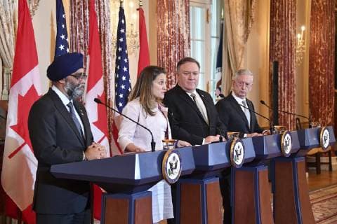 December 14, 2018 - Washington, DC, United States of America - U.S. Secretary of State Mike Pompeo, and U.S. Defense Secretary Jim Mattis, right, during a joint press conference with Canadian Minister of Defense Harjit Sajjan and Canadian Foreign Minister Chrystia Freeland, left, following the U.S. †Canada 2+2 Ministerial meeting at the Department of State December 14, 2018 in Washington, D.C. Washington United States of America - ZUMAp138 20181214_zaa_p138_007 Copyright: xMichaelxGrossx