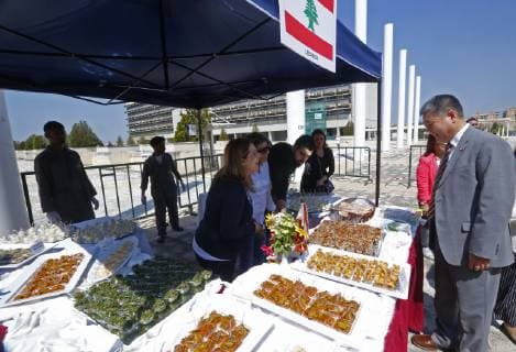 (190404) -- BEIRUT, April 4, 2019 -- Chinese Ambassador to Lebanon Wang Kejian (R) visits the stall of Lebanon at the Asian Gourmet Festival on the campus of the Lebanese University in Beirut, Lebanon, April 4, 2019. The Lebanese University held the Asian Gourmet Festival on Thursday to introduce students and youths in the country to the Asian culture. The one-day festival gathered 11 countries which displayed their traditional food, clothes and other products on the campus of the Lebanese University in the capital Beirut. ) LEBANON-BEIRUT-ASIAN GOURMET FESTIVAL BilalxJawich