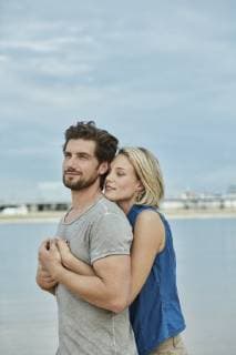 Affectionate young couple hugging at the riverbank model released Symbolfoto RORF01674