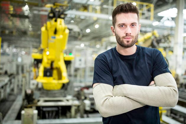 Portrait of confident worker in a modern factory model released Symbolfoto property released WESTF24306