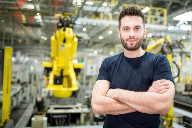 Portrait of confident worker in a modern factory model released Symbolfoto property released WESTF24314