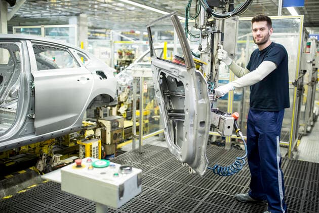 Portrait of confident worker in modern car factory model released Symbolfoto property released WESTF24339