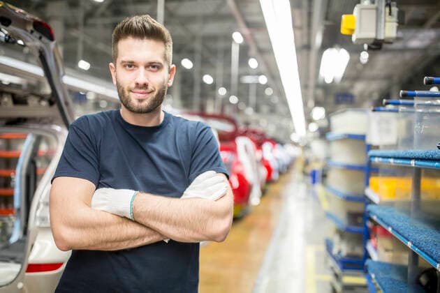Portrait of confident worker in modern car factory model released Symbolfoto property released WESTF24372