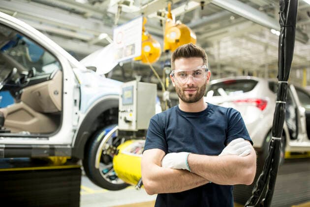 Portrait of confident worker in modern car factory model released Symbolfoto property released WESTF24385