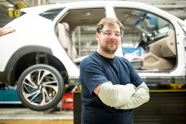 Portrait of confident worker in modern car factory model released Symbolfoto property released WESTF24386