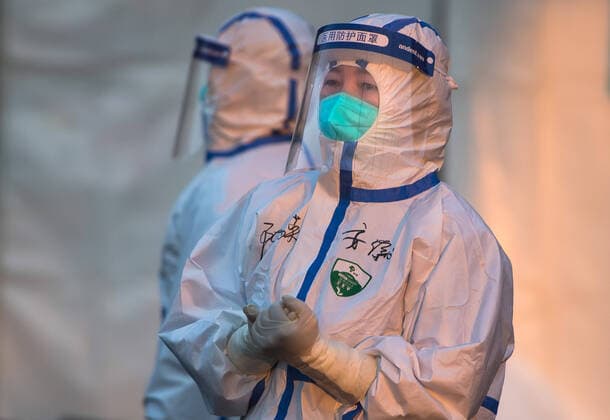 (200212) -- WUHAN, Feb. 12, 2020 -- Chen Liying (R), a medical staff from east China s Anhui Province, waits for patients at the temporary hospital converted from Wuhan Sports Center in Wuhan, central China s Hubei Province, Feb. 12, 2020. The temporary hospital converted from Wuhan Sports Center, with a total of 1,100 beds, started on Wednesday to admit patients with mild symptoms caused by the novel coronavirus. ) CHINA-HUBEI-WUHAN-NOVEL CORONAVIRUS-TEMPORARY HOSPITAL (CN) XiaoxYijiu