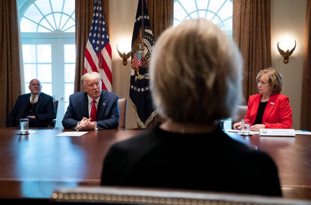 March 18, 2020, Washington, District of Columbia, USA: United States President Donald J. Trump, left, speaks to Debbie Hatmaker, right, Chief Nursing Officer of the ANA Enterprise, as he holds a meeting with nurses on the COVID-19 response at the White House in Washington, DC, March 18, 2020, in Washington, DC. Director of the Centers for Disease Control and Prevention Dr. Robert Redfield looks on from the left. .Credit: Pool via CNP Washington USA - ZUMAs152 20200318_zaa_s152_058 Copyright: xKevinxDietschx