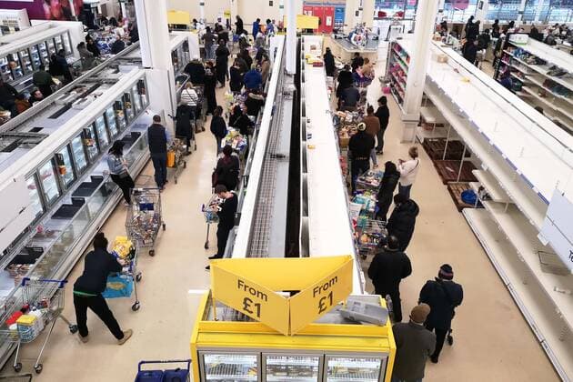 (200320) -- LONDON, March 20, 2020 (Xinhua) -- People go shopping in a Tesco supermarket in London, Britain, on March 20, 2020. Cafes, bars, pubs and restaurants must close from Friday night across Britain in a bid to contain the spread of COVID-19 outbreak, British Prime Minister Boris Johnson said Friday. As of 9 a.m. local time (0900 GMT) Friday, the number of confirmed COVID-19 cases in Britain reached 3,983, according to UK s Department of Health and Social Care. As of 1 p.m. (1300 GMT), 177 patients who tested positive for COVID-19 have died. (Photo by Joe Newman Xinhua) BRITAIN-LONDON-COVID-19-SHOPPING
