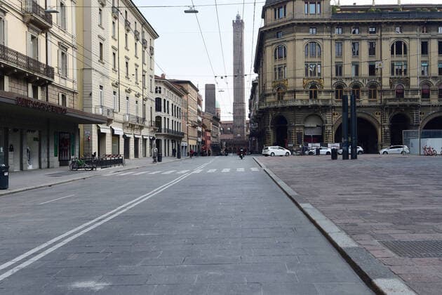 (200321) -- ROME, March 21, 2020 (Xinhua) -- Few people walk on the street in Bologna, Italy, March 20, 2020. Italy s Ministry of Health on Friday took the unprecedented step of closing all public parks, gardens and other open spaces, effective from Saturday. The coronavirus pandemic has claimed 4,032 lives in locked down Italy by Friday, with the number of cumulative cases reaching 47,021, according to new data released by the Civil Protection Department. (Photo by Gianni Schicchi Xinhua) ITALY-COVID-19-LOCKDOWN