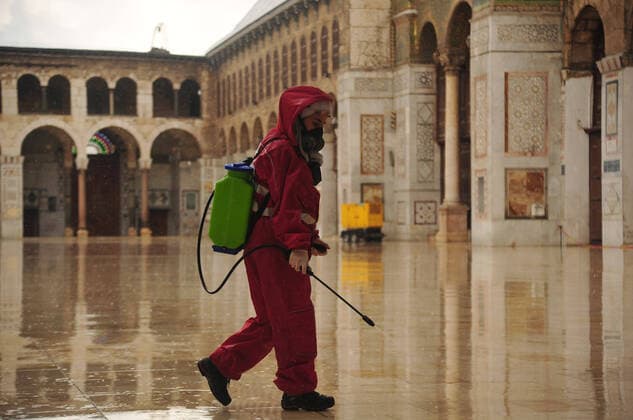 March 21, 2020, Damascus, Damascus, Syrian Arab Republic: Syrian workers disinfect the Great Umayyad Mosque, as a preventive measure amid fears of the spread of the coronavirus, in Damascus, Syria, on March 21, 2020. Even though no cases of coronavirus Covid-19 have yet been reported in the city, some people prefer to take precautionary measures Damascus Syrian Arab Republic - ZUMAap3_ 20200321_zaf_ap3_061 Copyright: xOmarxEstwanix