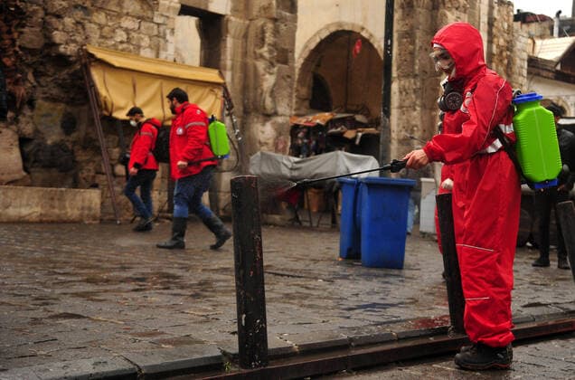 March 21, 2020, Damascus, Damascus, Syrian Arab Republic: Syrian workers disinfect the old market, as a preventive measure amid fears of the spread of the coronavirus, in Damascus, Syria, on March 21, 2020. Even though no cases of coronavirus Covid-19 have yet been reported in the city, some people prefer to take precautionary measures Damascus Syrian Arab Republic - ZUMAap3_ 20200321_zaf_ap3_068 Copyright: xOmarxEstwanix