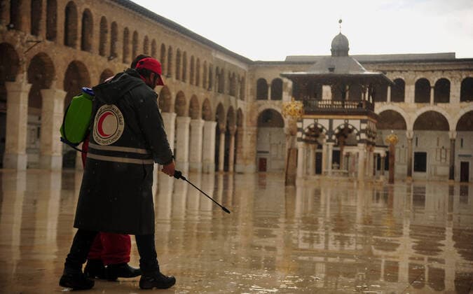 March 21, 2020, Damascus, Damascus, Syrian Arab Republic: Syrian workers disinfect the Great Umayyad Mosque, as a preventive measure amid fears of the spread of the coronavirus, in Damascus, Syria, on March 21, 2020. Even though no cases of coronavirus Covid-19 have yet been reported in the city, some people prefer to take precautionary measures Damascus Syrian Arab Republic - ZUMAap3_ 20200321_zaf_ap3_072 Copyright: xOmarxEstwanix