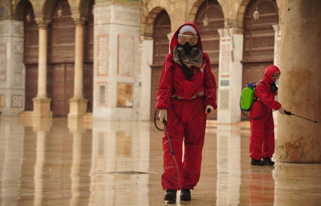 March 21, 2020, Damascus, Damascus, Syrian Arab Republic: Syrian workers disinfect the Great Umayyad Mosque, as a preventive measure amid fears of the spread of the coronavirus, in Damascus, Syria, on March 21, 2020. Even though no cases of coronavirus Covid-19 have yet been reported in the city, some people prefer to take precautionary measures Damascus Syrian Arab Republic - ZUMAap3_ 20200321_zaf_ap3_077 Copyright: xOmarxEstwanix