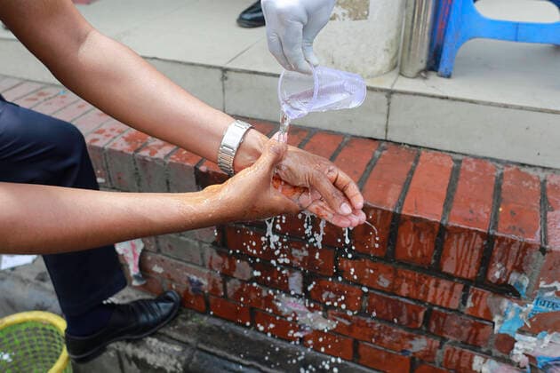 March 22, 2020, Dhaka, Dhaka, Bangladesh: Bangladeshi security officials take precaution during the spread of coronavirus, in Dhaka, Bangladesh, March 22, 2020. 3 more tested positive for COVID-19, raising the number of coronavirus patients to 27 in Bangladesh. The Bangladeshi government has imposed a restriction on all kinds of political, social, cultural and religious gatherings in an effort to contain the further spread of novel coronavirus in the country. Besides, people having fever, cough, influenza or other symptoms of COVID-19 as well as family members of coronavirus-infected patients and those come in contact with the patients have been asked not to go to mosques and other worship places. Dhaka Bangladesh - ZUMAd117 20200322_zap_d117_008 Copyright: xSuvraxKantixDasx