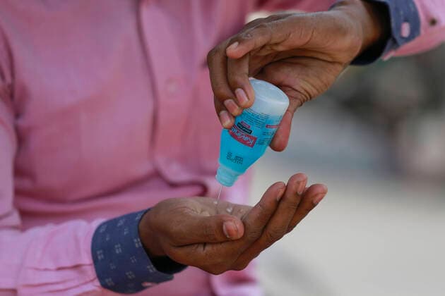 March 22, 2020, Dhaka, Dhaka, Bangladesh: A Bangladeshi man uses hand sanitizer as he take precaution during the spread of coronavirus, in Dhaka, Bangladesh, March 22, 2020. 3 more tested positive for COVID-19, raising the number of coronavirus patients to 27 in Bangladesh. The Bangladeshi government has imposed a restriction on all kinds of political, social, cultural and religious gatherings in an effort to contain the further spread of novel coronavirus in the country. Besides, people having fever, cough, influenza or other symptoms of COVID-19 as well as family members of coronavirus-infected patients and those come in contact with the patients have been asked not to go to mosques and other worship places. Dhaka Bangladesh - ZUMAd117 20200322_zap_d117_015 Copyright: xSuvraxKantixDasx