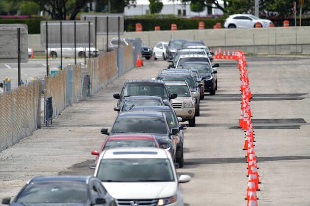 March 23, 2020, Miami Gardens, Florida, United States Of America: MIAMI GARDENS, FL - MARCH 22: FIRST RESPONDERS ONLY TESTING DAY - Instead of setting up for the Miami Open tennis tournament, the Florida National Guard (many without face masks due to shortage) was running a drive-through testing site off the Florida Turnpike at the Hard Rock Stadium in Miami Gardens where people can go for a COVID-19 Test Without Getting out of their Cars. As Miami-Dade Countys number of COVID-19 cases rise to 169, the site will open at 9 a.m. Monday in the east parking lot of the Hard Rock Stadium, 347 Don Shula Drive. The testing is free and the site will be open from 9 a.m. to 5 p.m. on a daily basis, said Juan Diasgranados, a spokesperson for the testing site. The test site will be run and was created by several local, state and national agencies wh - ZUMAs214 20200323_zaa_s214_031 Copyright: xSMGx