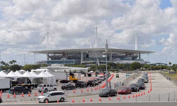 MIAMI GARDENS, FL - MARCH 22: FIRST RESPONDERS ONLY TESTING DAY - Instead of setting up for the Miami Open tennis tournament, the Florida National Guard (many without face masks due to shortage) was running a drive-through testing site off the Florida Turnpike at the Hard Rock Stadium in Miami Gardens where people can go for a COVID-19 Test Without Getting out of their Cars. As Miami-Dade Countyâ€⠢s number of COVID-19 cases rise to 169, the site will open at 9 a.m. Monday in the east parking lot of the Hard Rock Stadium, 347 Don Shula Drive. The testing is free and the site will be open from 9 a.m. to 5 p.m. on a daily basis, said Juan Diasgranados, a spokesperson for the testing site. The test site will be run and was created by several local, state and national agencies which include FEMA, the CDC, Florida Department of Health, Flo - ZUMAs214 20200323_zba_s214_018 Copyright: xSMGx