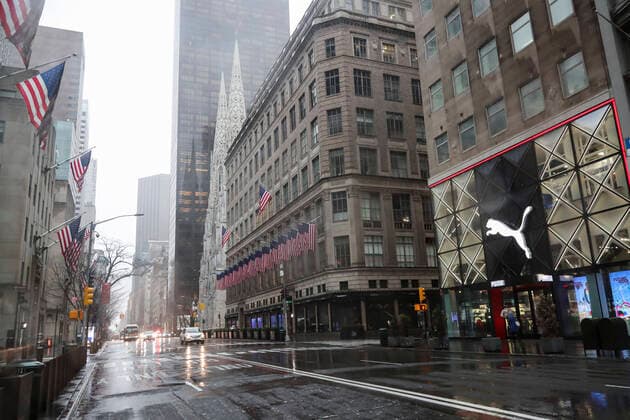 (200324) -- NEW YORK, March 24, 2020 -- Pedestrians and vehicles are hardly seen on the Fifth Avenue in New York, the United States, March 23, 2020. The number of confirmed COVID-19 cases in New York City has reached 13,119 as of Monday night local time, according to data of the Center for Systems Science and Engineering (CSSE) at Johns Hopkins University. A total of 124 deaths have been reported in the city, according to the CSSE. The largest U.S. city with a population of 8.6 million has become a new epicenter of the outbreak, taking about 30 percent of the nation s tally of 43,901. ) U.S.-NEW YORK-COVID-19 WangxYing