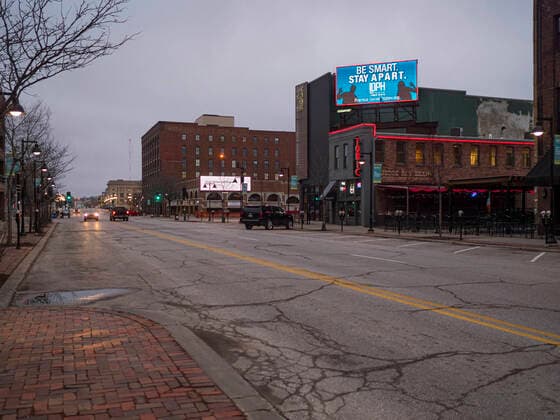 March 24, 2020, Des Moines, Iowa, U.S: A public service announcement about the coronavirus on an electronic billboard in the historic district of downtown Des Moines. Des Moines was virtually deserted Tuesday as many people chose to stay in their homes. On Tuesday morning, 24 March, Iowa reported over 120 confirmed cases of the Coronavirus (SARS-CoV-2) and COVID-19. Restaurants, bars, movie theaters, places that draw crowds are closed for at least 30 days. The Governor has not ordered shelter in place but several Mayors, including the Mayor of Des Moines, have asked residents to stay in their homes for all but the essential needs. People are being encouraged to practice social distancing and many businesses are requiring or encouraging employees to telecommute. Des Moines U.S. - ZUMAk94_ 20200324_zaf_k94_003 Copyright: xJackxKurtzx