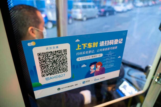 (200325) -- WUHAN, March 25, 2020 -- Photo taken on March 25, 2020 shows a QR code for registration in a bus in Wuhan, central China s Hubei Province. Wuhan, the once hardest-hit city in central China s Hubei Province during the COVID-19 outbreak, resumed a total of 117 bus routes starting Wednesday, around 30 percent of the city s total bus transport capacity, the municipal transport bureau said. According to a spokesperson of the bureau, passengers must wear masks, register with their names and scan a QR code, and take a temperature check before taking buses and subways. ) CHINA-HUBEI-WUHAN-COVID-19-BUS ROUTES-RESUMPTION (CN) CaixYang