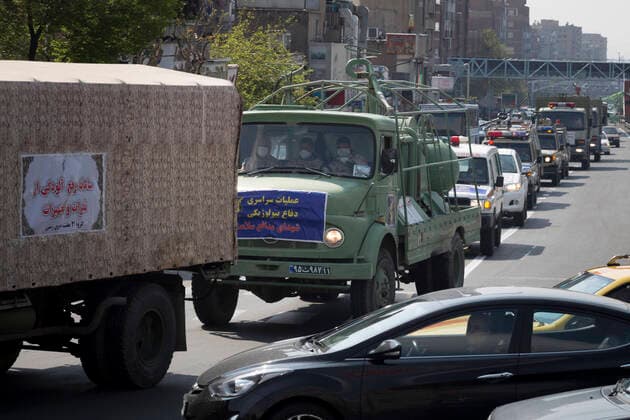 March 25, 2020, Tehran, Iran: Iran s Revolutionary Guard Corps carry out disinfection works as a preventive measure against the coronavirus (Covid-19) pandemic as part of the biological defense drill, launched in coordination with the National Headquarters For Fighting The Coronavirus, in 100 different points in Tehran, Iran. Iran launched the 3-day biological defense drill at 3,000 locations across the country. A total of 143 people in Iran have died of coronavirus over the last 24 hours, pushing the death toll up to 2,077, said Iranian health authorities on Wednesday. Italy, China, Iran, and Spain continue to be the most affected countries. Tehran Iran - ZUMAf146 20200325_zip_f146_005 Copyright: xRouzbehxFouladix