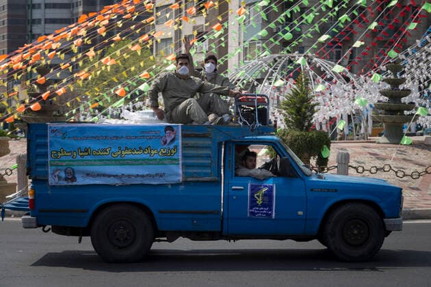 March 25, 2020, Tehran, Iran: Iran s Revolutionary Guard Corps carry out disinfection works as a preventive measure against the coronavirus (Covid-19) pandemic as part of the biological defense drill, launched in coordination with the National Headquarters For Fighting The Coronavirus, in 100 different points in Tehran, Iran. Iran launched the 3-day biological defense drill at 3,000 locations across the country. A total of 143 people in Iran have died of coronavirus over the last 24 hours, pushing the death toll up to 2,077, said Iranian health authorities on Wednesday. Italy, China, Iran, and Spain continue to be the most affected countries. Tehran Iran - ZUMAf146 20200325_zip_f146_021 Copyright: xRouzbehxFouladix