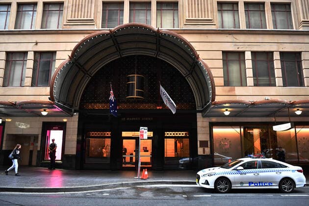 AUSTRALIA CORONAVIRUS COVID-19, NSW Police stand guard outside the Swissotel Hotel in Market Street, Sydney, Thursday, March 26, 2020. The hotel, which has been declared a human health response zone , is believed to be holding Australian passengers from the Norwegian Jewel cruiseliner, who arrived in Sydney on a Qantas charter flight from Hawaii during the early hours of this morning. ( NO ARCHIVING, EDITORIAL USE ONLY, NO USE IN BOOKS WITHOUT CONSENT SYDNEY NSW AUSTRALIA Copyright: xDEANxLEWINSx 20200326001459897100