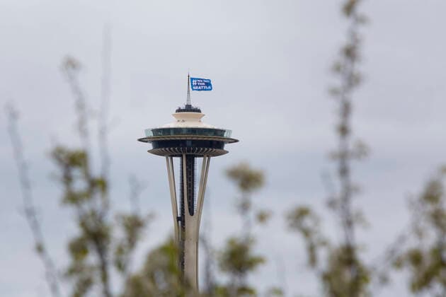 March 28, 2020, Seattle, Washington, U.S: A flag reading â€oeWe Got This Seattle†flies over the Seattle Space Needle on Saturday, March 28, 2020. Under governor Jay Insleeâ€⠢s statewide stay home proclamation, now extended until April 6, people are able to leave their homes only for essential activities including grocery shopping, exercise and caring for a family member, friend or pet. Seattle U.S. - ZUMAg235 20200328_zap_g235_013 Copyright: xPaulxChristianxGordonx