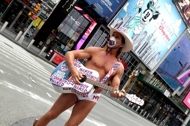 March 30, 2020, New York City, New York, US: In the city that never sleeps and at the Crossroads of the World, a magnet that is Times Square, indications of life is to been seen. Pictured is Robert John Burck better known as the Naked Cowboy, an American actor, singer, songwriter, writer and street performer in an empty Times Square. New York City US - ZUMAl135 20200330_zap_l135_022 Copyright: xG.xRonaldxLopezx