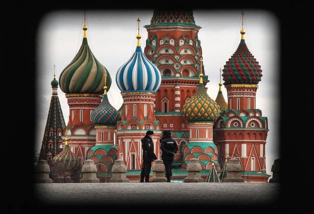 MOSCOW, RUSSIA - APRIL 2, 2020: Police officers seen by St Basil s Cathedral in Red Square. The Moscow authorities imposed home isolation for all Moscow residents, regardless of their age, and restrictions on movement within the city, effective since March 30, 2020, as a measure to contain the spread of the COVID-19 coronavirus infection. Violations of the stay-at-home order carry fines ranging from 1,000 to 40,000 rubles for non-infected people, and up to 1m rubles or imprisonment for up to 3 years for infected people, depending on the severity of consequences. Valery Sharifulin TASS TS0D43B3