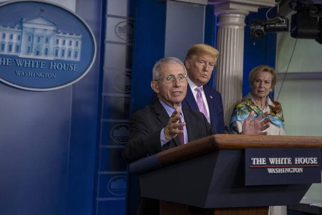 U.S. President Donald Trump White House coronavirus response coordinator Deborah Birx listen to Anthony Fauci, Director of the National Institute of Allergy and Infectious Diseases speak at the coronavirus briefing at the White House Washington, D.C., U.S., on Saturday, April 4, 2020. New York s death toll from coronavirus on Saturday surpassed 3,500 as confirmed cases rose to 113,704, bringing the U.S. total to more than 7,700 fatalities and 287,000 cases. wax20200404102 TasosxKatopodis