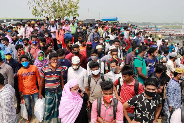 April 5, 2020, Mawa, Dhaka, Bangladesh: Thousands of readymade garment workers from across the country had either walked or used alternative modes of transpiration to reach capital Dhaka over the past few days, as owners decided to open the factories amid a government-enforced soft shutdown to prevent the novel coronavirus from spreading further. But following harsh criticisms, BGMEA was forced to keep the factories closed until April 11. The workers were told to go back home when they went to the factories to join work on Sunday morning. These photoss of people returning to their village homes were taken at the Shimulia ferry terminal in Mawa, near Dhaka, Bangladesh, April 05, 2020. Mawa Bangladesh - ZUMAd117 20200405_zap_d117_010 Copyright: xSuvraxKantixDasx