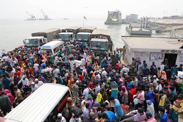 April 5, 2020, Mawa, Dhaka, Bangladesh: Thousands of readymade garment workers from across the country had either walked or used alternative modes of transpiration to reach capital Dhaka over the past few days, as owners decided to open the factories amid a government-enforced soft shutdown to prevent the novel coronavirus from spreading further. But following harsh criticisms, BGMEA was forced to keep the factories closed until April 11. The workers were told to go back home when they went to the factories to join work on Sunday morning. These photoss of people returning to their village homes were taken at the Shimulia ferry terminal in Mawa, near Dhaka, Bangladesh, April 05, 2020. Mawa Bangladesh - ZUMAd117 20200405_zap_d117_019 Copyright: xSuvraxKantixDasx