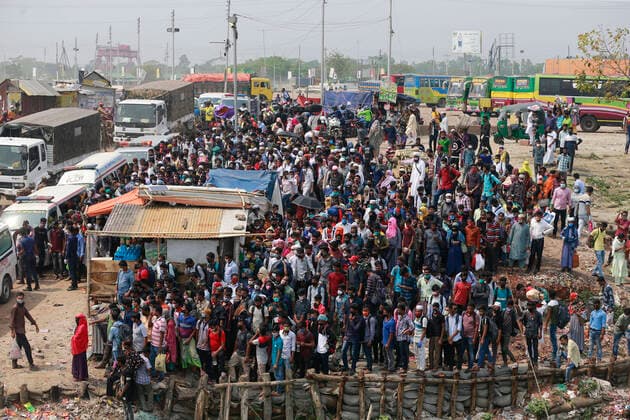 April 5, 2020, Mawa, Dhaka, Bangladesh: Thousands of readymade garment workers from across the country had either walked or used alternative modes of transpiration to reach capital Dhaka over the past few days, as owners decided to open the factories amid a government-enforced soft shutdown to prevent the novel coronavirus from spreading further. But following harsh criticisms, BGMEA was forced to keep the factories closed until April 11. The workers were told to go back home when they went to the factories to join work on Sunday morning. These photoss of people returning to their village homes were taken at the Shimulia ferry terminal in Mawa, near Dhaka, Bangladesh, April 05, 2020. Mawa Bangladesh - ZUMAd117 20200405_zap_d117_042 Copyright: xSuvraxKantixDasx