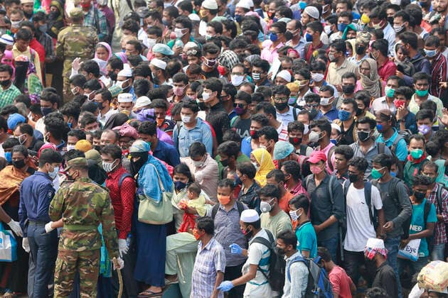 April 5, 2020, Mawa, Dhaka, Bangladesh: Thousands of readymade garment workers from across the country had either walked or used alternative modes of transpiration to reach capital Dhaka over the past few days, as owners decided to open the factories amid a government-enforced soft shutdown to prevent the novel coronavirus from spreading further. But following harsh criticisms, BGMEA was forced to keep the factories closed until April 11. The workers were told to go back home when they went to the factories to join work on Sunday morning. These photoss of people returning to their village homes were taken at the Shimulia ferry terminal in Mawa, near Dhaka, Bangladesh, April 05, 2020. Mawa Bangladesh - ZUMAd117 20200405_zap_d117_048 Copyright: xSuvraxKantixDasx