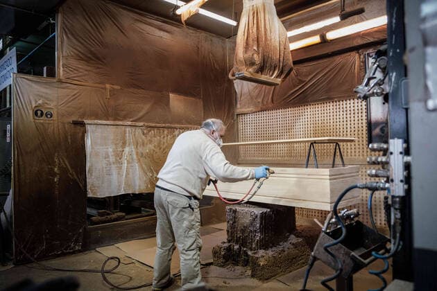April 8, 2020, Barcelona, Spain: A worker paints a coffin in the largest coffin factory in Catalonia...Coronavirus outbreak in Spain has already killed 14,659 people. The large number of deaths has forced Eurocoffin, the main coffin factory in Catalonia, to triple its production, from 50 to 150 coffins per day. Isolation and quarantine prevent family members from gettting infected or infect others. In Spain today, the pandemic leaves numbers of 146,690 infected and 48,021 recovered. Barcelona Spain - ZUMAs197 20200408_zaa_s197_156 Copyright: xPabloxMiranzox