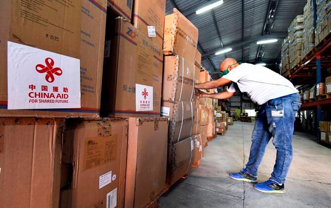 (200410) -- HAVANA, April 10, 2020 (Xinhua) -- A staff member checks medical supplies donated by China at the Cuban Ministry of Public Health s warehouses in Havana, Cuba, April 9, 2020. Cuba started on Thursday to distribute medical supplies donated by China to help stem the spread of COVID-19 nationwide. Some 500 infrared thermometers, 2,000 sets of protective clothing, goggles and shoe covers, 2,000 N95 face masks and 10,000 surgical masks donated by the Chinese government arrived in Cuba on Sunday night. Also on Sunday, 10,000 protective suits and 100,000 face masks, donated by China s Zhengzhou Yutong Bus Co., reached the country. (Photo by Joaquin Hernandez Xinhua) CUBA-CHINA-COVID-19-CHINESE DONATION