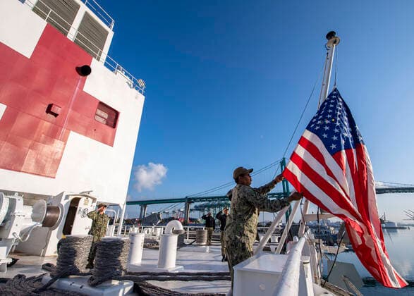 Los Angeles LOS ANGELES, USA -- 29 Mar 2020 -- US Navy Logistics Specialist 1st Class Tavares Littleton, from Chicago, raises the national ensign during morning colors aboard the hospital ship USNS Mercy (T-AH 19), March 29, 2020. Mercy deployed in support of the nation s COVID-19 response efforts, and will serve as a referral hospital for non-COVID-19 patients currently admitted to shore-based hospitals. This allows shore base hospitals to focus their efforts on COVID-19 cases. One of the Department of Defense s missions is Defense Support of Civil Authorities. DoD is supporting the Federal Emergency Management Agency, the lead federal agency, as well as state, local and public health authorities in helping protect the health and safety of the American people -- Picture by Atlas Photo Archive US Navy Ryan Breeden, United States on 2020 0 EP_ATL