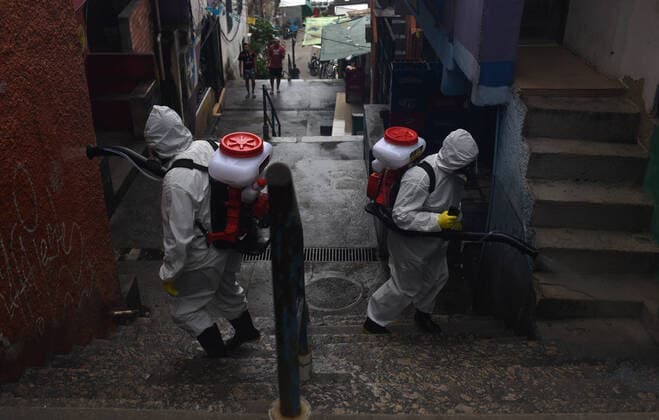 April 10, 2020: April 11.., 2020, Rio De Janeiro - ......Residents of the Santa Marta favela, in Botafogo, in the South Zone of Rio, start this Friday (10) to work on cleaning the areas of the community on their own. The objective is to prevent the lack of sanitary conditions from facilitating the expansion of the Covid-19 region. volunteers start the process with personal protective equipment (PPE). The Botafogo neighborhood, where the Santa Marta slum is located, had 36 confirmed cases of the new coronavirus as of this Sunday, according to the State Health Secretariat Panel. In the municipality of Rio alone, 1068 cases were recorded, according to the same panel. Cases across the state totaled 1394 cases..on April 10, 2020. - ZUMAt142 20200410_zap_t142_008 Copyright: xFabioxTeixeirax