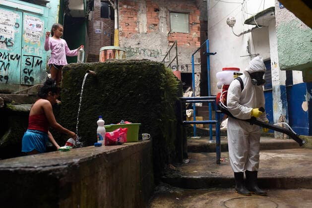 April 10, 2020: April 11.., 2020, Rio De Janeiro - ......Residents of the Santa Marta favela, in Botafogo, in the South Zone of Rio, start this Friday (10) to work on cleaning the areas of the community on their own. The objective is to prevent the lack of sanitary conditions from facilitating the expansion of the Covid-19 region. volunteers start the process with personal protective equipment (PPE). The Botafogo neighborhood, where the Santa Marta slum is located, had 36 confirmed cases of the new coronavirus as of this Sunday, according to the State Health Secretariat Panel. In the municipality of Rio alone, 1068 cases were recorded, according to the same panel. Cases across the state totaled 1394 cases..on April 10, 2020. - ZUMAt142 20200410_zap_t142_015 Copyright: xFabioxTeixeirax