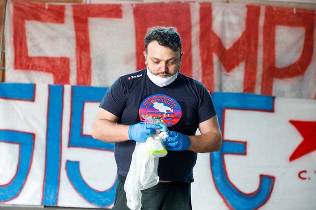 April 11, 2020, Naples, Campania, Italy: Italy, 11 04 2020, Naples, Scampia district, a group of associations from the northern area of the Neapolitan city with their volunteers, to face the poverty of families in the period of the quarantine for the pandemic for the covid-19 virus, go around the houses delivering basic necessities for Easter. Naples Italy - ZUMAs236 20200411_zap_s236_018 Copyright: xFabioxSassox