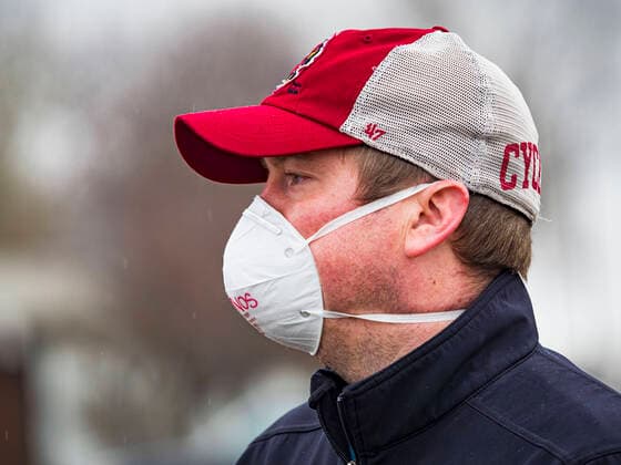 April 11, 2020, Des Moines, Iowa, U.S: JASON CLARK , from Midwest Foods, directs traffic during a food distribution in Des Moines. Most non-essential businesses in Iowa are closed until 30 April. Because of business closings causes by the Novel Coronavirus (SARS-CoV-2) pandemic, well over 100,000 Iowans filed first time claims for unemployment in the last three weeks, more than applied during the peak of the Great Recession of 2008. Local food banks have seen an unprecedented spike in people seeking nutritional assistance. Midwest Foods, a Des Moines based company and owner of Ginos Fine Italian Foods, gave away 1,000 complete dinners with sauce, noodles, salad, and dressing Saturday morning. People started lining up 3 hours before the food distribution began. The food distribution was done following social distancing guidelines and a - ZUMAk94_ 20200411_zaf_k94_012 Copyright: xJackxKurtzx