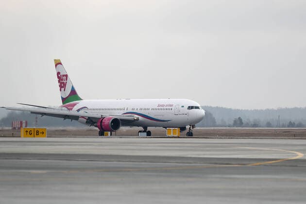 YEKATERINBURG, RUSSIA - APRIL 13, 2020: A Sunday Airlines plane carrying humanitarian aid makes a landing at Koltsovo International Airport. The first of the four humanitarian shipments to Russia s Ural Federal District, the charter flight from Shanghai has brought around $5m worth of medical supplies, such as non-reusable and high-level protection masks, face shields, protective goggles and suits, antiseptics and touch-free thermometers, over 10,6m items totaling more than 100t in weight. Equally divided between the Sverdlovsk and Chelyabinsk Regions, it will be sent to healthcare, budgetary, charitable institutions and volunteer organisations. Donat Sorokin TASS TS0D57EE