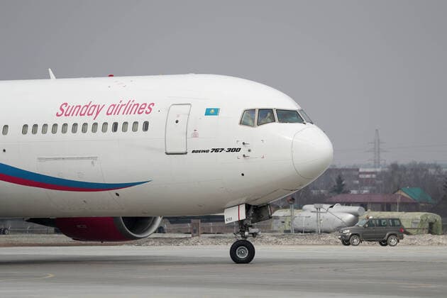YEKATERINBURG, RUSSIA - APRIL 13, 2020: A Sunday Airlines plane carrying humanitarian aid arrives at Koltsovo International Airport. The first of the four humanitarian shipments to Russia s Ural Federal District, the charter flight from Shanghai has brought around $5m worth of medical supplies, such as non-reusable and high-level protection masks, face shields, protective goggles and suits, antiseptics and touch-free thermometers, over 10,6m items totaling more than 100t in weight. Equally divided between the Sverdlovsk and Chelyabinsk Regions, it will be sent to healthcare, budgetary, charitable institutions and volunteer organisations. Donat Sorokin TASS TS0D57EF