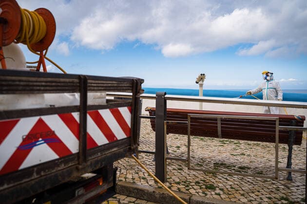 April 14, 2020, Ericeira, Portugal: An employee of the Ericeira parish council, equipped with the recommended protective materials, disinfects the street with a solution based on hypochlorite (bleach)..The municipality of Mafra had 70 cases of COVID-19 pandemic. In order to prevent the spread of the virus, the Ericeira Parish Council perform weekly street disinfection. Ericeira Portugal - ZUMAs197 20200414_zaa_s197_179 Copyright: xHenriquexCasinhasx