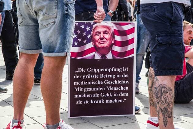 May 9, 2020, Munich, Bavaria, Germany: A Trump poster at a Munich, Germany hygiene demo. Despite ongoing relaxing measures, a Querfront (cross-front) mixture of 3,000 conspiracy theorists, QAnon followers, left-extremists, right-extremists, and Widerstand2020 assembled for a third weekend in Munich s city center, primarily at Marienplatz, to demonstrate for restoration of the Grundgesetz amid the Coronavirus crisis. Such demos and daily mini-demos with an overwhelming 2015-2016 Pegida quality are being staged throughout Germany, with two attacks on journalists for ARD and ZDF having taken place. Internally, members of the official Munich chat group have been planning attacks on journalists for the past week, with many of the more active members coming from right-extremist and neonazi circles and de - ZUMAb160 20200509_zbp_b160_042 Copyright: xSachellexBabbarx