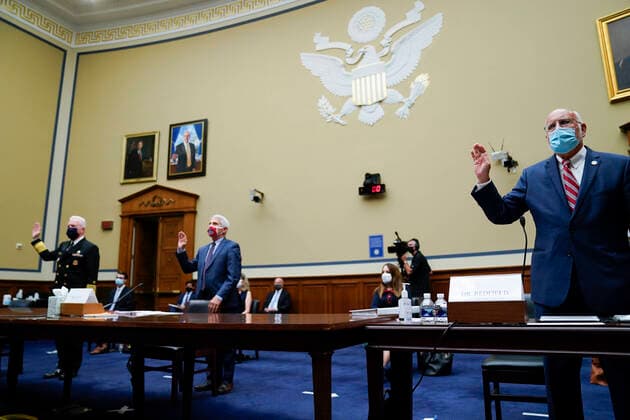 Robert Redfield, director of the Centers for Disease Control and Prevention (CDC), from right, Anthony Fauci, director of the National Institute of Allergy and Infectious Diseases, and Admiral Brett Giroir, U.S. assistant secretary for health, swear in to a House Select Subcommittee on the Coronavirus Crisis hearing in Washington, D.C., U.S., on Friday, July 31, 2020. Trump administration officials are set to defend the federal government s response to the coronavirus crisis at the hearing hosted by a House panel calling for a national plan to contain the virus. Photographer: Erin Scott Bloomberg Pool Copyright: xPoolxviaxCNPx MediaPunchx